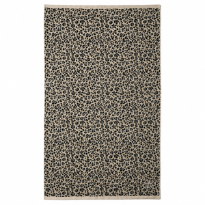 packshot du drap de plage moelleux motif leopard coton bio atelier dune 