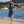 Femme a la plage portant un poncho leger en coton biologique coloris outremer - Atelier Dune